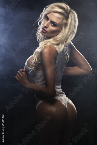 Naklejka dekoracyjna Sexy beautiful blonde woman posing in white shirt.