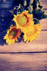 Canvas Print - Beautiful sunflowers on table close-up