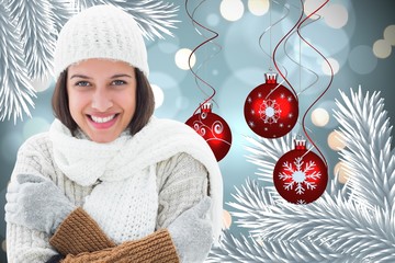 Poster - Composite image of brunette in warm clothing