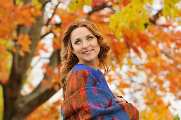 autumn portrait of beautiful stylish young woman in blue knitted