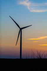 Wall Mural - wind turbine at sunset background