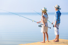 Boy And Girl With Fishing Rods