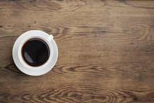 Black Coffee Cup On Old Wooden Table Top View