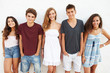 © Monkey Business - Portrait Of Teenage Group Leaning Against Wall