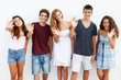 © Monkey Business - Teenage Group Leaning Against Wall Waving
