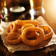 © Joshua Resnick - crispy onion rings with ketchup on parchment paper