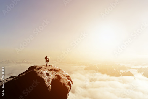 Fotomural Asian man, fighter practices martial arts in high mountains
