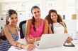 © Monkey Business - Women Using Laptop In Modern Office Of Start Up Business