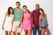 © Monkey Business - Group Of Friends Leaning Against White Wall