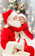 © Syda Productions - smiling little girl with santa claus