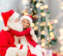 Smiling Little Girl With Santa Claus