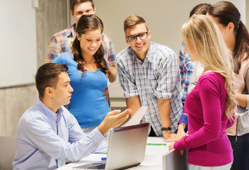 Canvas Print - group of students and teacher with laptop