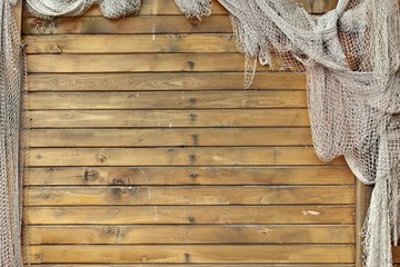 Hanging Fishnet on Wood Wall