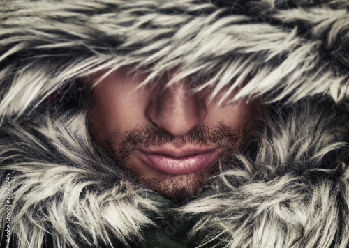 Naklejka dekoracyjna brutal face of man with beard bristles and hooded winter