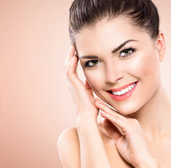 Beauty teenage model girl portrait over pink background