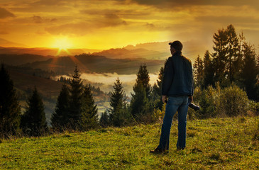 Wall Mural - Man photographer in the mountains.