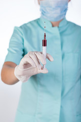 Wall Mural - Syringe with blood sample