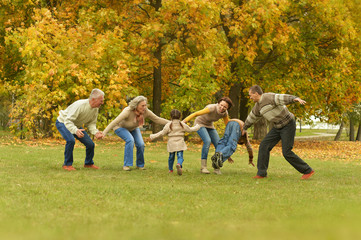 Poster - family relaxing in autumn forest