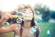 © Eugenio Marongiu - beautiful young woman with white dress blowing bubble