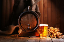 Beer Barrel With Beer Glass On Table On Wooden Background