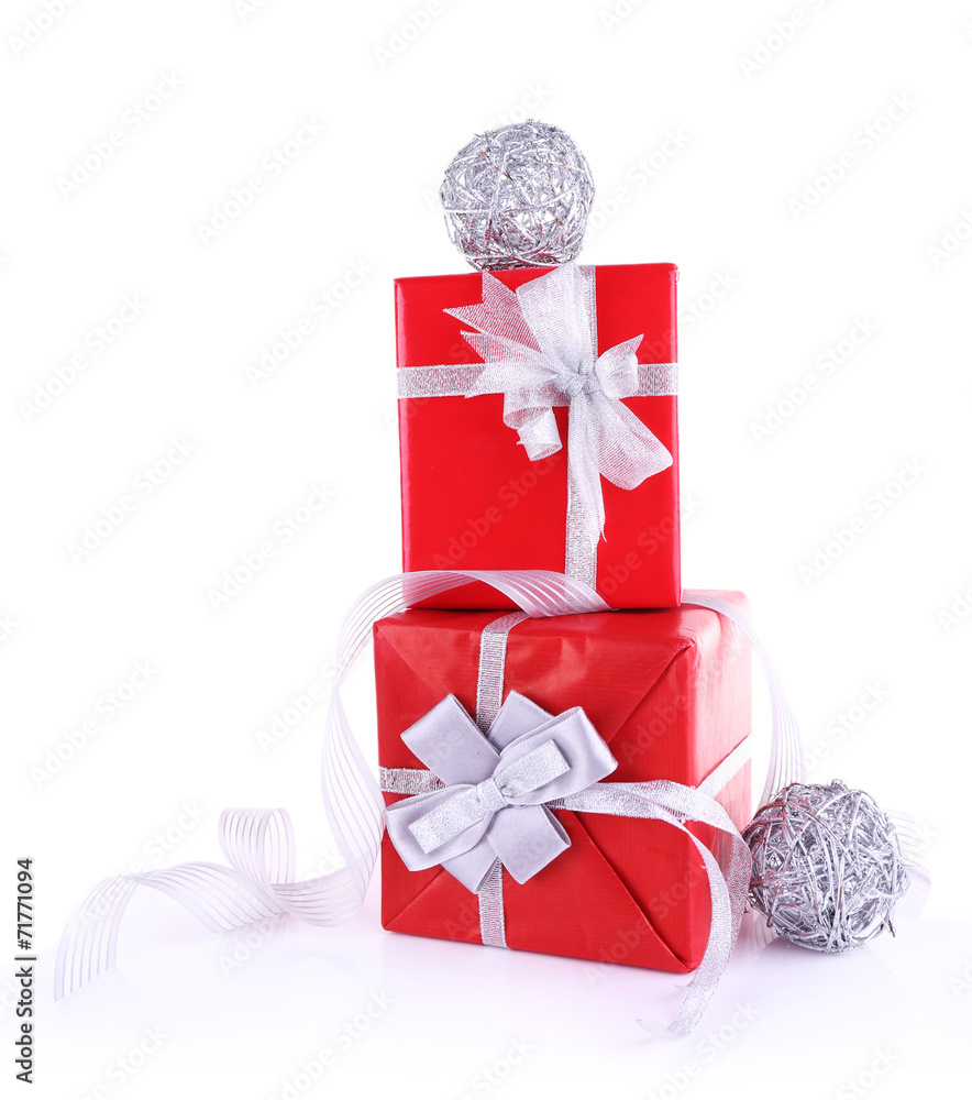 Red holiday gift boxes decorated with ribbon isolated on white