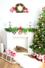 Wall Mural - Christmas tree near fireplace in room