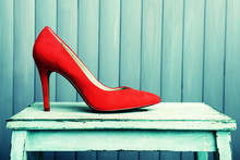 Red Women Shoes On Wooden Background