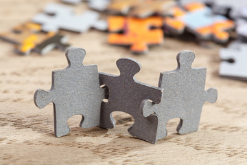 three jigsaw puzzle pieces on table