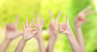 © Africa Studio - People show different hands signs on green background