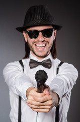 Funny singer with microphone at the concert