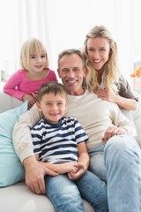 Portrait of a cheerful family on the couche