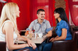 © bokan - Group of friends talking in a cafe bar