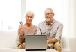 © Syda Productions - happy senior couple with laptop and credit card