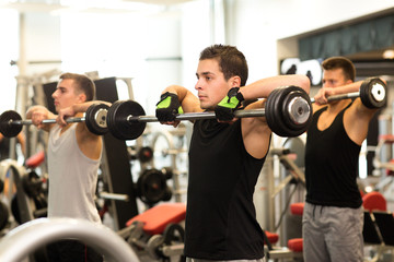 Canvas Print - group of men with barbells in gym