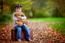 Little Boy With Suitcase And Teddy Bear