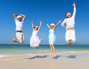 Canvas Print - Two Couple Celebrating on the Beach on Christmas