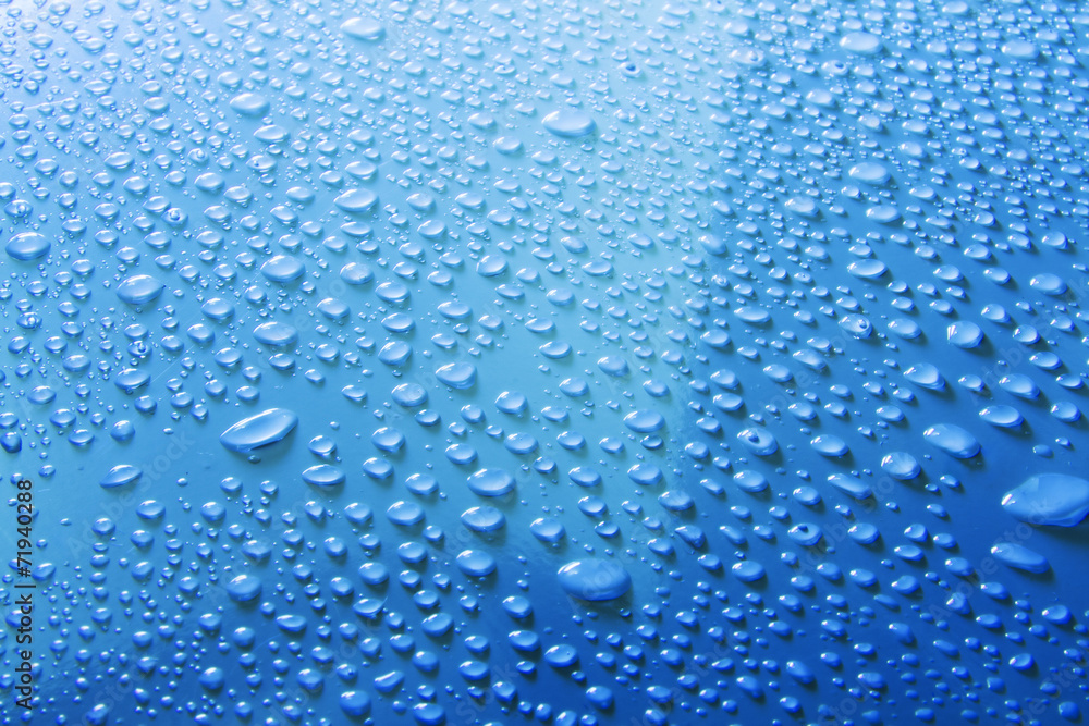 water drops on blue surface - obrazy, fototapety, plakaty 
