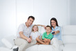 © Dave_Pot - young family posing on sofa