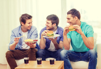 Sticker - smiling friends with soda and hamburgers at home