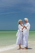 © Darren Baker - Happy Senior Couple Dancing Holding Hands on Beach