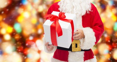 Poster - close up of santa claus with gift box