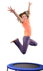 Wall Mural - cute elementary girl jumping and dancing over white