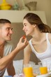 © WavebreakMediaMicro - Cute couple having breakfast in bed