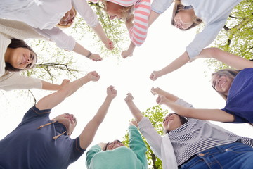 young friends staying together outdoor in the park