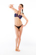 © bruno135_406 - model isolated on plain background pointing to herself