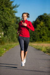 Wall Mural - Urban leisure - woman running outdoor