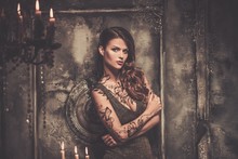 Tattooed Beautiful Woman In Old Spooky Interior