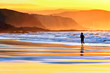 © mimadeo - person running on beach at sunset
