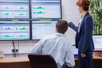 Poster - Focused colleagues analyzing result on their computer