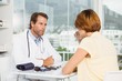 © WavebreakMediaMicro - Doctor in discussion with patient at medical office